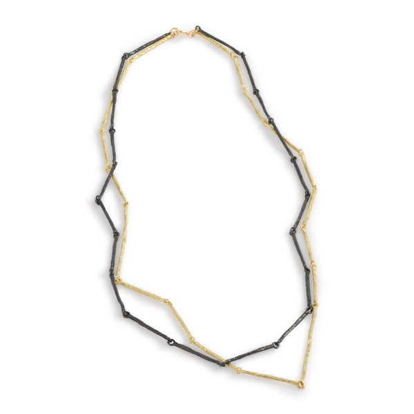 The Mystic Gold & Black Bars Necklace by Emanuela Duca - A fusion of textured blackened sterling silver and 18k yellow gold. With a classic flair, this piece embodies timeless elegance and sophistication.