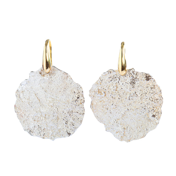 The Spark & Soul textured discs earrings feature a beautiful, sleek sculptural ear wire in 18k yellow gold. These earrings offer a bright, contemporary, and romantic look that frames your face, making them perfect for both everyday life and special occasions. • Sterling silver, 18k yellow gold • Length: 1.25"
