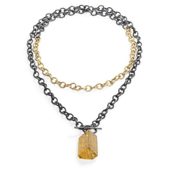 Raw You Golden Beryl Stone Necklace by Emanuela Duca - This statement necklace is a versatile fusion of 18k yellow gold and blackened sterling silver. Wear it long or doubled for added flair. Adorned with an asymmetrical golden beryl stone, it embodies elegance with a touch of modernity. Length: 43 inches. One of a kind.