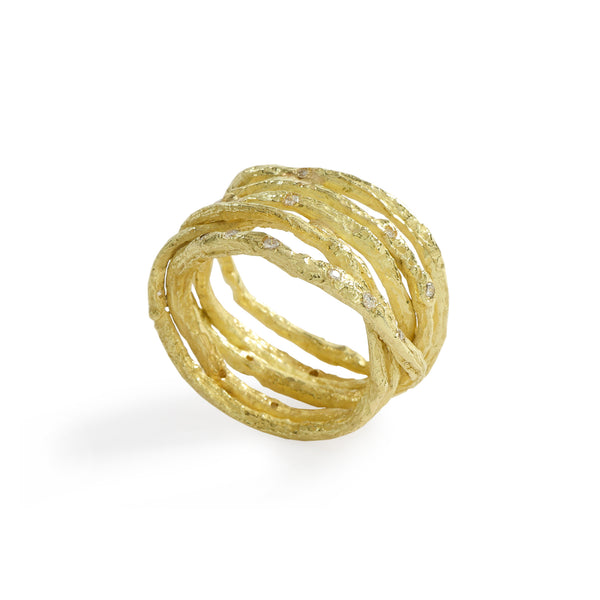 Colibri' Textured Lines Ring by Emanuela Duca - Introducing the Colibri ring in 18k yellow gold, adorned with textured organic lines. This beautiful, elegant piece wraps around the finger gracefully, accentuated by tiny diamonds. Its design exudes spontaneity and playfulness, mirroring the spirit of the hummingbird. • Diamonds cts 0.18; 18k yellow gold