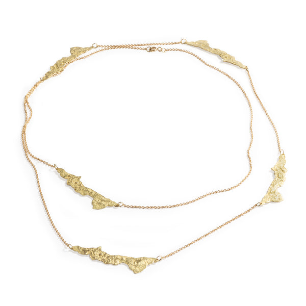 Good Vibes Textured Gold Necklace by Emanuela Duca - Crafted with five free-form elements in textured 18K yellow gold, interspersed with delicate gold chains, this necklace offers versatility and charm in equal measure.