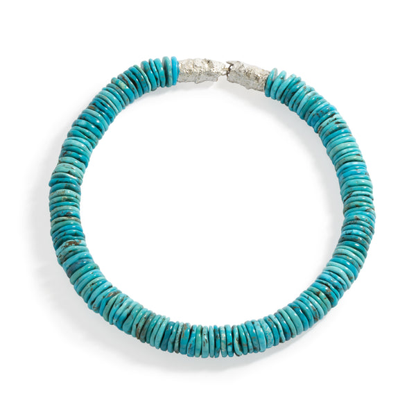 Good Vibes Turquoise Necklace by Emanuela Duca - A necklace adorned with exquisite turquoise stones and fastened with a textured sterling silver clasp. Designed to stay close to the face, it effortlessly illuminates your features with its vibrant hues, exuding a sense of positivity and grace. One of a kind.