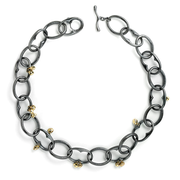 The InsideOut necklace features bold blackened sterling silver links accented with 18k yellow gold elements, adorned with small diamonds. This striking piece combines fashion and movement with a rock & roll edge, making it a standout accessory.  • Blackened sterling silver, 18k yellow gold, diamonds 0.09 cts  • Length: 20"