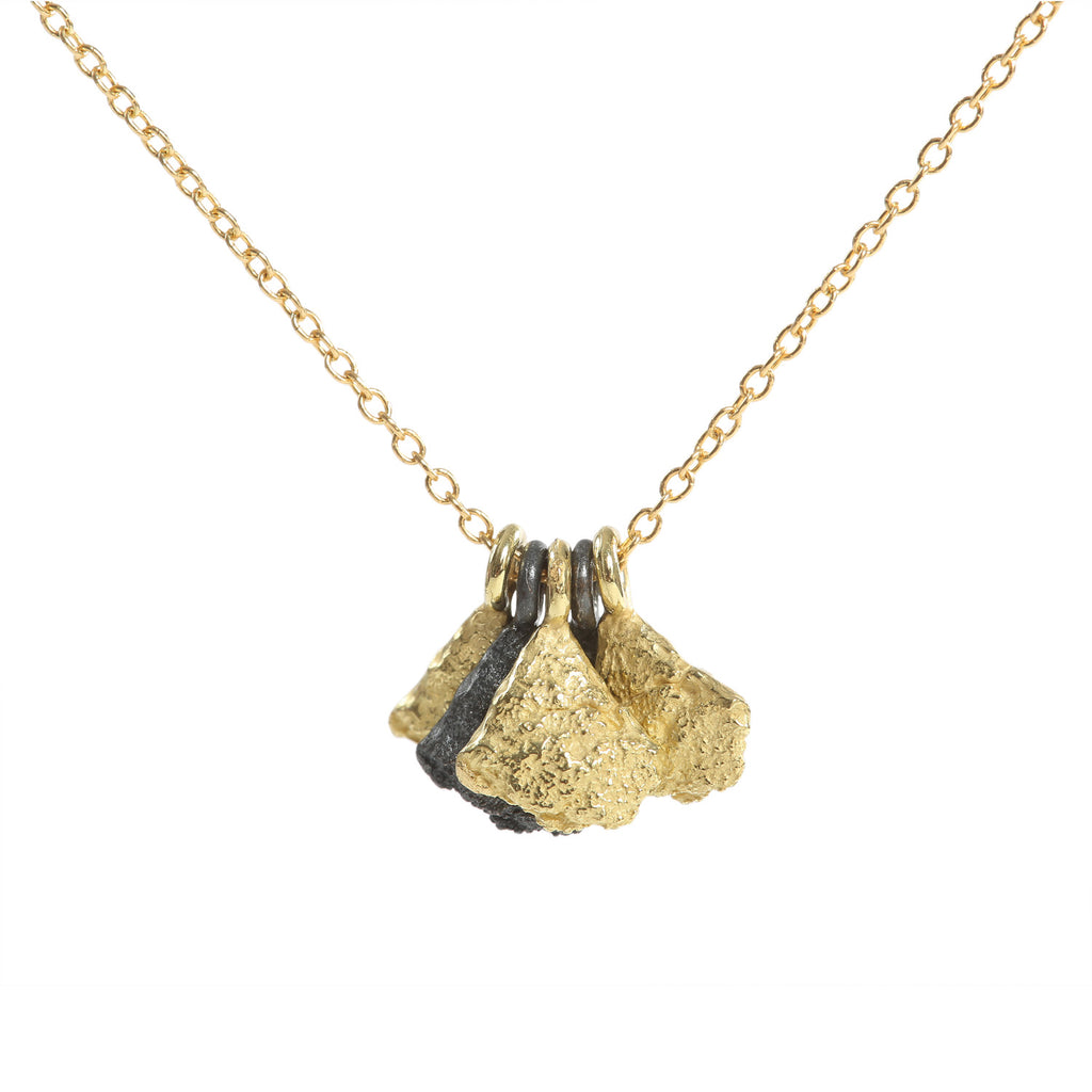 This Svelare necklace showcases a series of textured elements alternating between radiant 18k yellow gold and alluring blackened sterling silver. This harmonious fusion of boldness and refinement epitomizes timeless elegance, making it suitable for both everyday wear and special occasions alike.  • Length: 18"