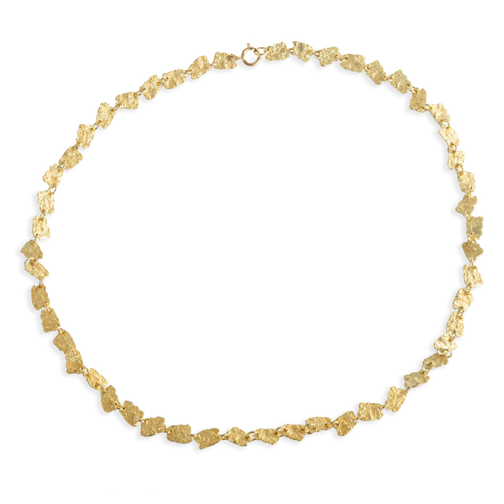 As the textured 18k yellow gold pieces come together to form the November's Moon necklace, they create a harmonious composition that evokes a sense of beauty and sophistication. Whether worn for a special occasion or as an everyday statement piece, the November's Moon necklace is sure to capture attention and inspire admiration for its exquisite craftsmanship and timeless charm.&nbsp;  • Length: 16.5"