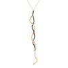 The Mystic Black & Gold Pendant  by Emanuela Duca - The Mystic pendant is crafted in 18k yellow gold and blackened sterling silver. Its intricate texture and contrasting metals create a captivating allure, accentuated by a long, sensual pendant delicately held by a thin chain. It's more than jewelry; it's a wearable sculpture, a testament to elegance and artistry. 