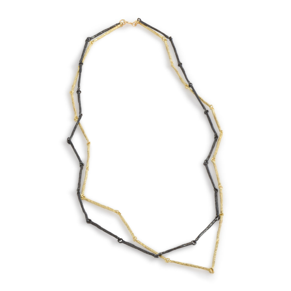 The Mystic Gold & Black Bars Necklace by Emanuela Duca - A fusion of textured blackened sterling silver and 18k yellow gold. With a classic flair, this piece embodies timeless elegance and sophistication.