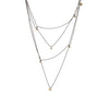The Mystic Necklace by Emanuela Duca - A delicate fusion of blackened sterling silver and gleaming gold nuggets. Its textured thin chain moves softly, creating ever-changing combinations. Proudly part of the Mystic collection, it embodies constant transformation and timeless allure. Wear it long, double it up, or hook it in various places for distinct styles. Its adaptability adds a touch of intrigue to any look, making it a must-have accessory. 