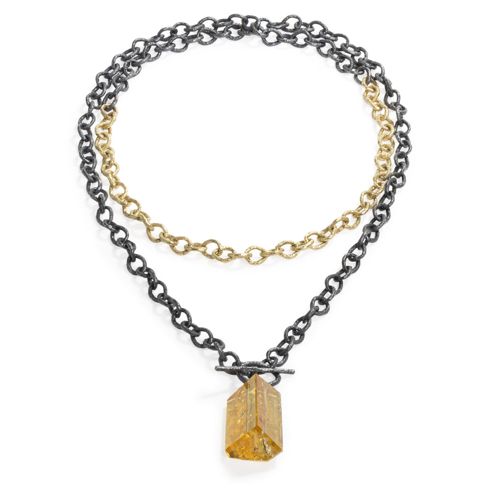 Raw You Golden Beryl Stone Necklace by Emanuela Duca - This statement necklace is a versatile fusion of 18k yellow gold and blackened sterling silver. Wear it long or doubled for added flair. Adorned with an asymmetrical golden beryl stone, it embodies elegance with a touch of modernity. Length: 43 inches. One of a kind.