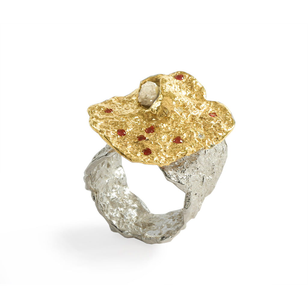 Colibri' Ruby & Diamond Ring by Emanuela Duca - The Colibri ring is both sculptural and playful. Crafted in 9k yellow gold, it features a striking raw diamond, accompanied by 8 vibrant rubies (1.5mm) and 4 sparkling white diamonds (1.5mm). The shank, crafted in highly textured sterling silver, adds depth and character to this unique piece. • Raw diamond; Ruby; white diamonds; 9k yellow gold
