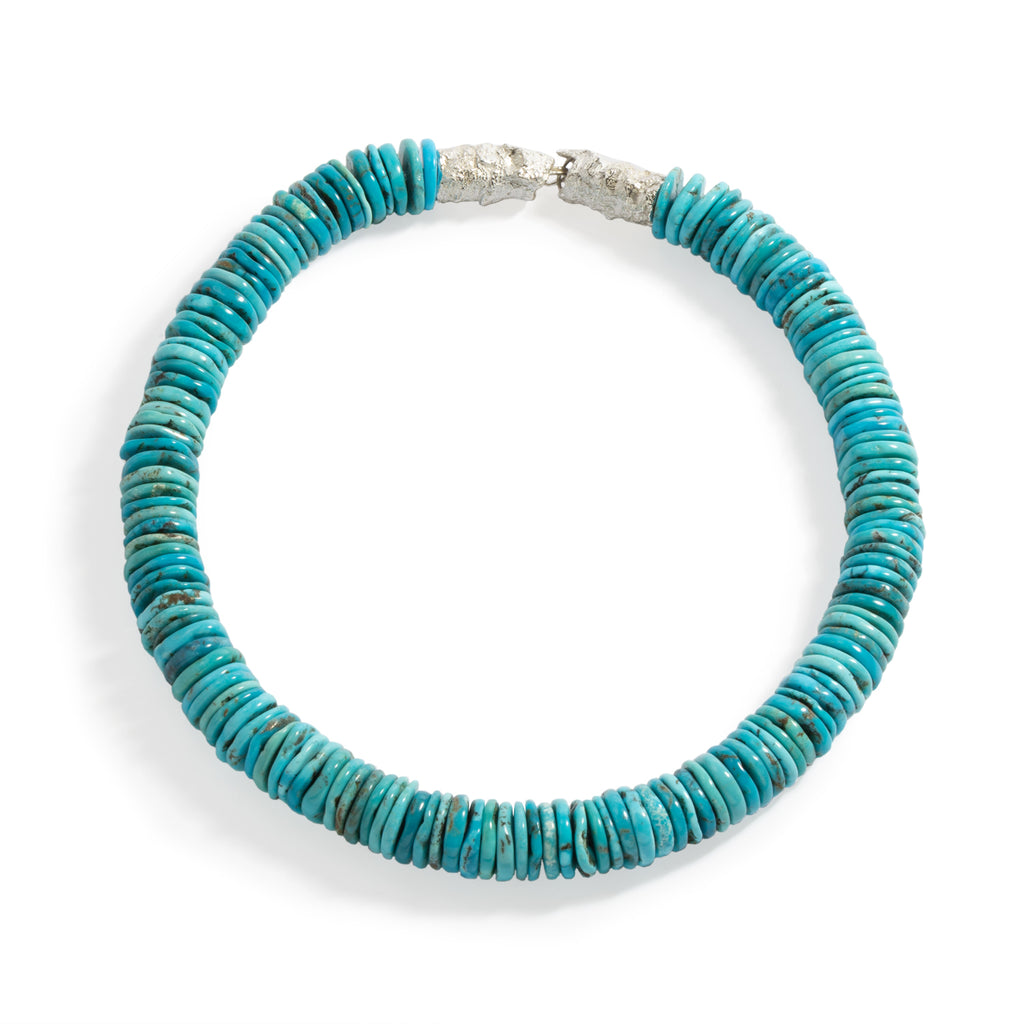 Good Vibes Turquoise Necklace by Emanuela Duca - A necklace adorned with exquisite turquoise stones and fastened with a textured sterling silver clasp. Designed to stay close to the face, it effortlessly illuminates your features with its vibrant hues, exuding a sense of positivity and grace. One of a kind.