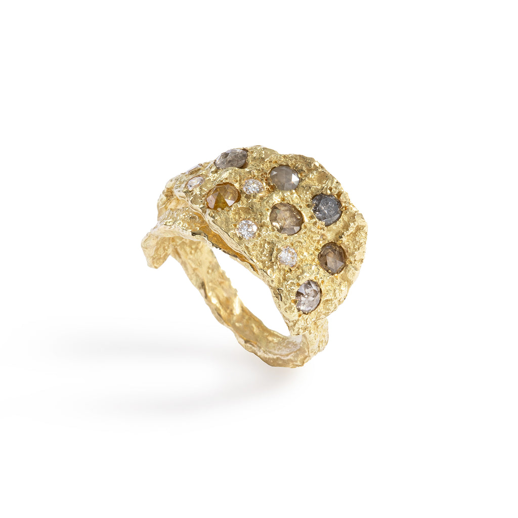 The Mystic Gold & Diamond Ring by Emanuela Duca - The stunning Mystic ring, crafted in 18k yellow gold and adorned with seven rose-cut mixed-color diamonds (4-3mm) and five white diamonds (2mm). This statement piece exudes originality and elegance, reminiscent of the ancient world with a modern flair. Its design wraps around the finger with personality, making it a captivating addition to any collection