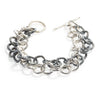 Good Vibes Black & White Bracelet by Emanuela Duca - A bold interplay of black and white textured sterling silver links. This captivating piece is defined by the stark contrast between the two lines of links, creating a visually stunning and versatile accessory.