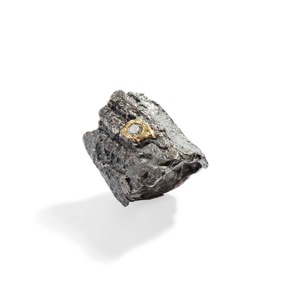 Raw You Blackened Sterling Silver With Diamond Ring by Emanuela Duca -Introducing our captivating ring: a fusion of raw sophistication and modern elegance. Crafted from textured blackened sterling silver, it features a 4mm cognac diamond set against raw 18k yellow gold. Embodying contemporary style with a touch of edge, this piece elevates any ensemble with its unique allure.