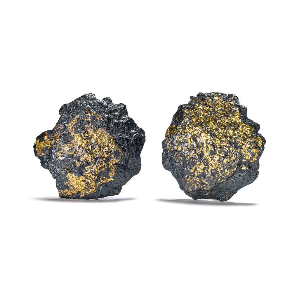 The Burst earrings in blackened sterling silver are accentuated by delicate 18k yellow gold leaf detailing and are secured at the back with clips and posts for a secure fit.  • Blackened sterling silver, 18k yellow gold leaf  • Available in clips &amp; posts