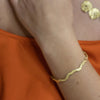 Sunshine Wavy 18k Gold Bangle by Emanuela Duca. Sculptural Fine Jewelry Handcrafted in 18k, Sterling Silver, Bronze, diamonds, and precious gems - Made in Rome & New York